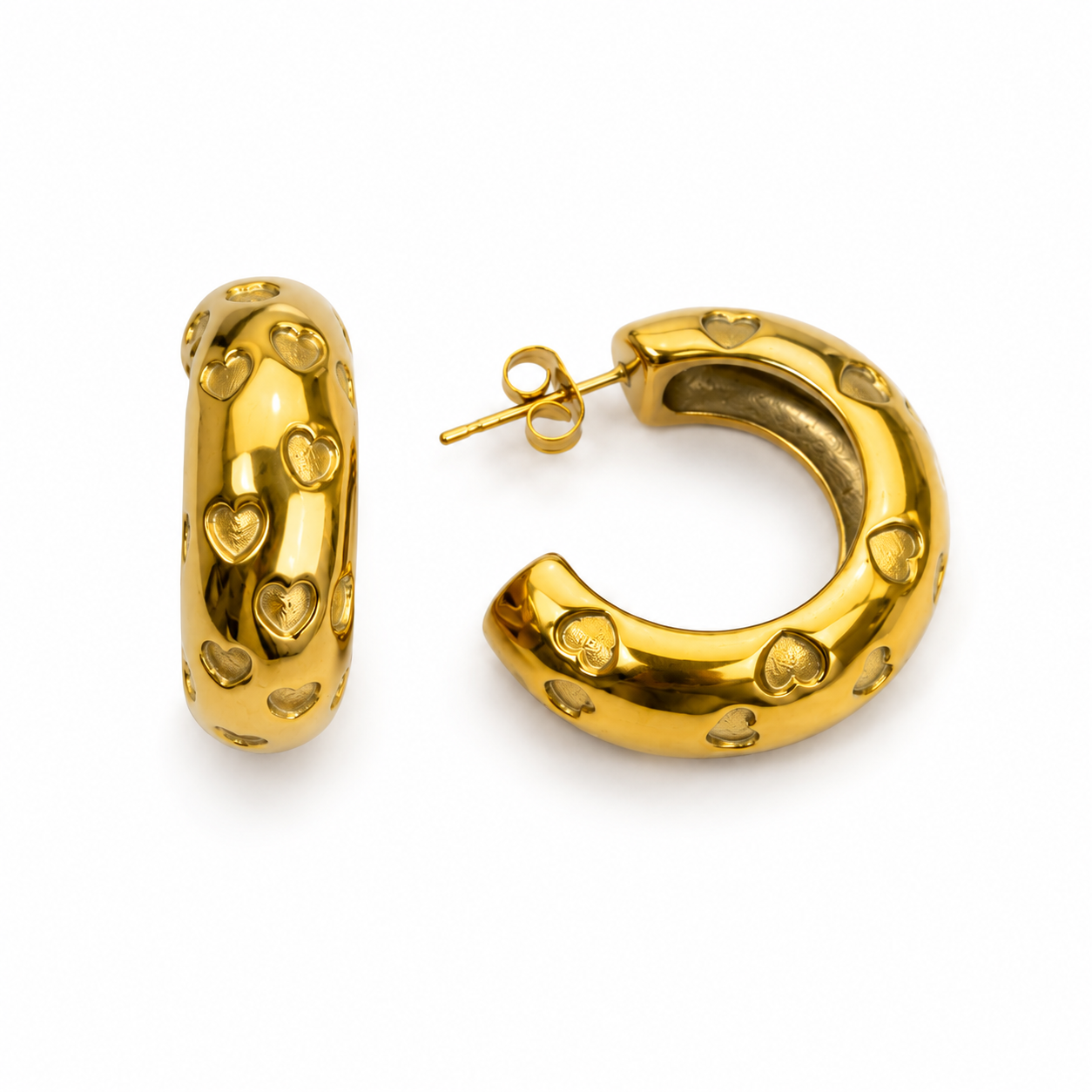 Side view of Ani Hearts gold open hoop earrings with raised heart details on a white background