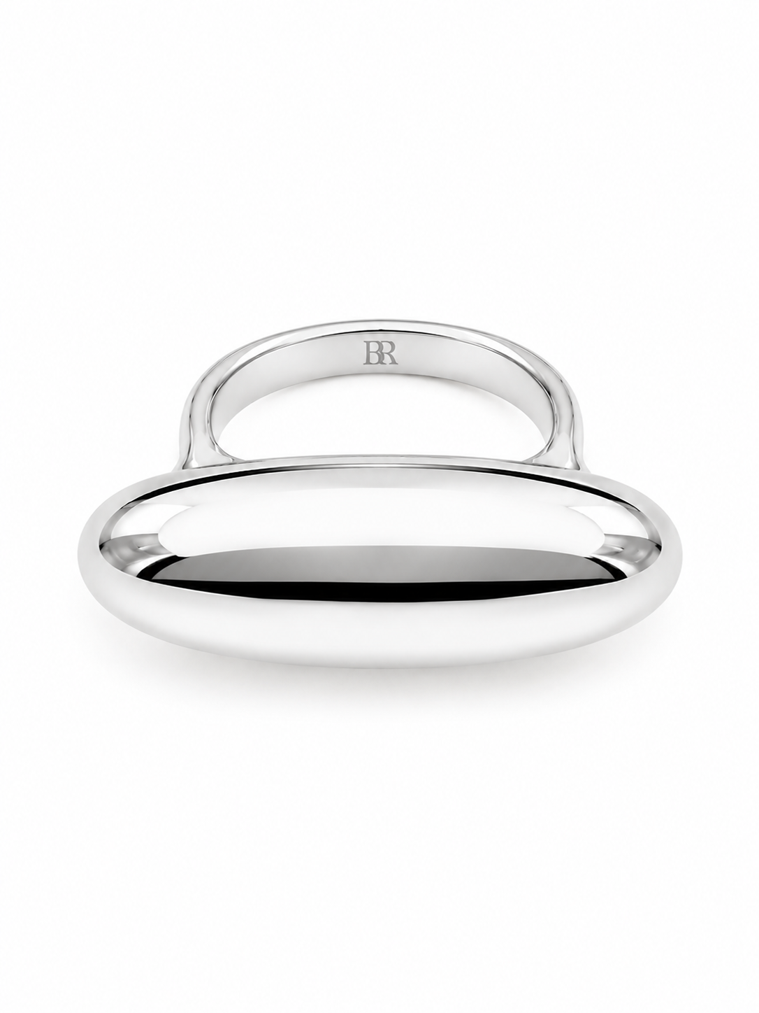 Back view of the silver Camelia Elongated Ring with a smooth sculptural top, polished band, and engraved BR logo on a white background.