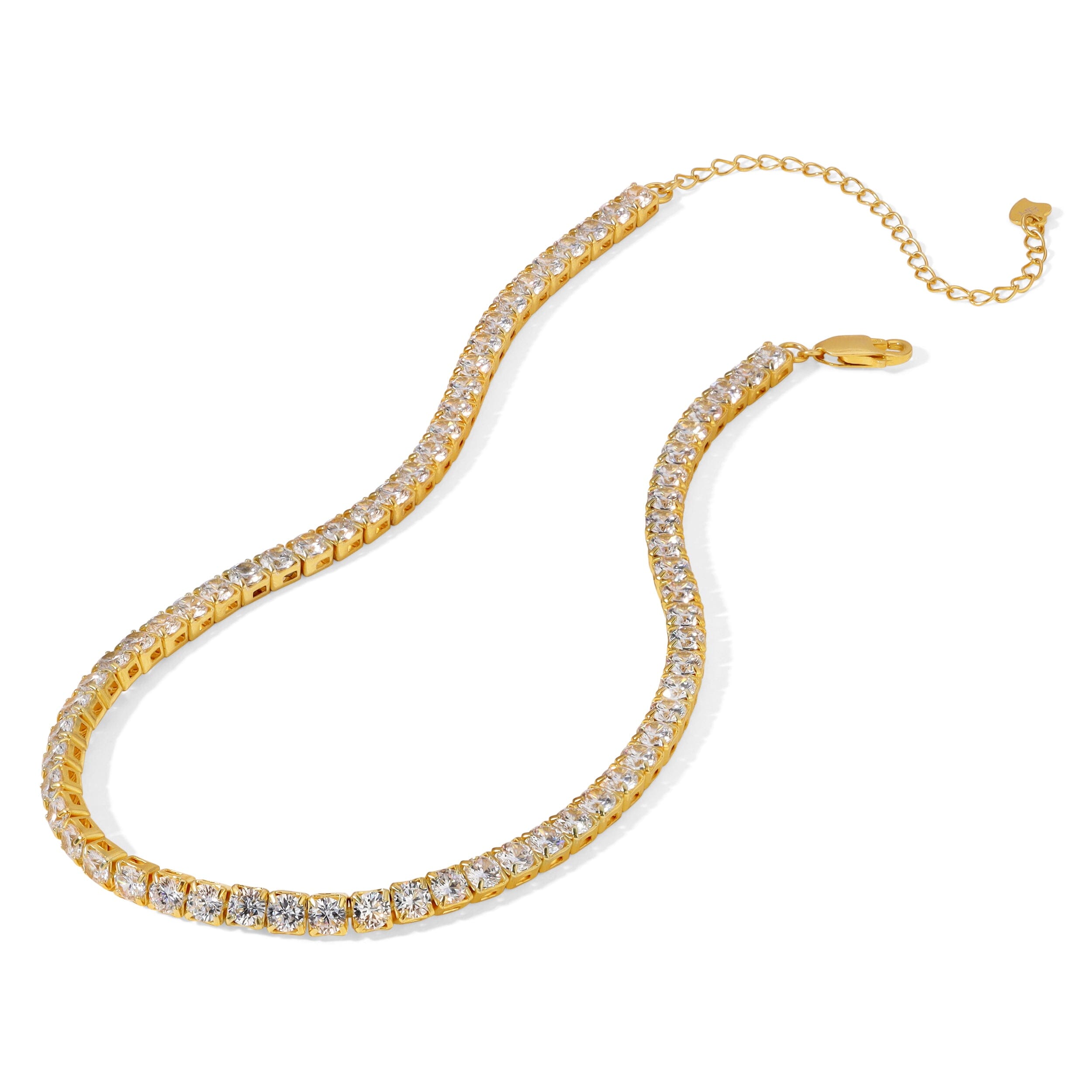 Clara gold tennis choker necklace with clear 4 mm stones, lobster clasp, and adjustable extension chain displayed on a white background.
