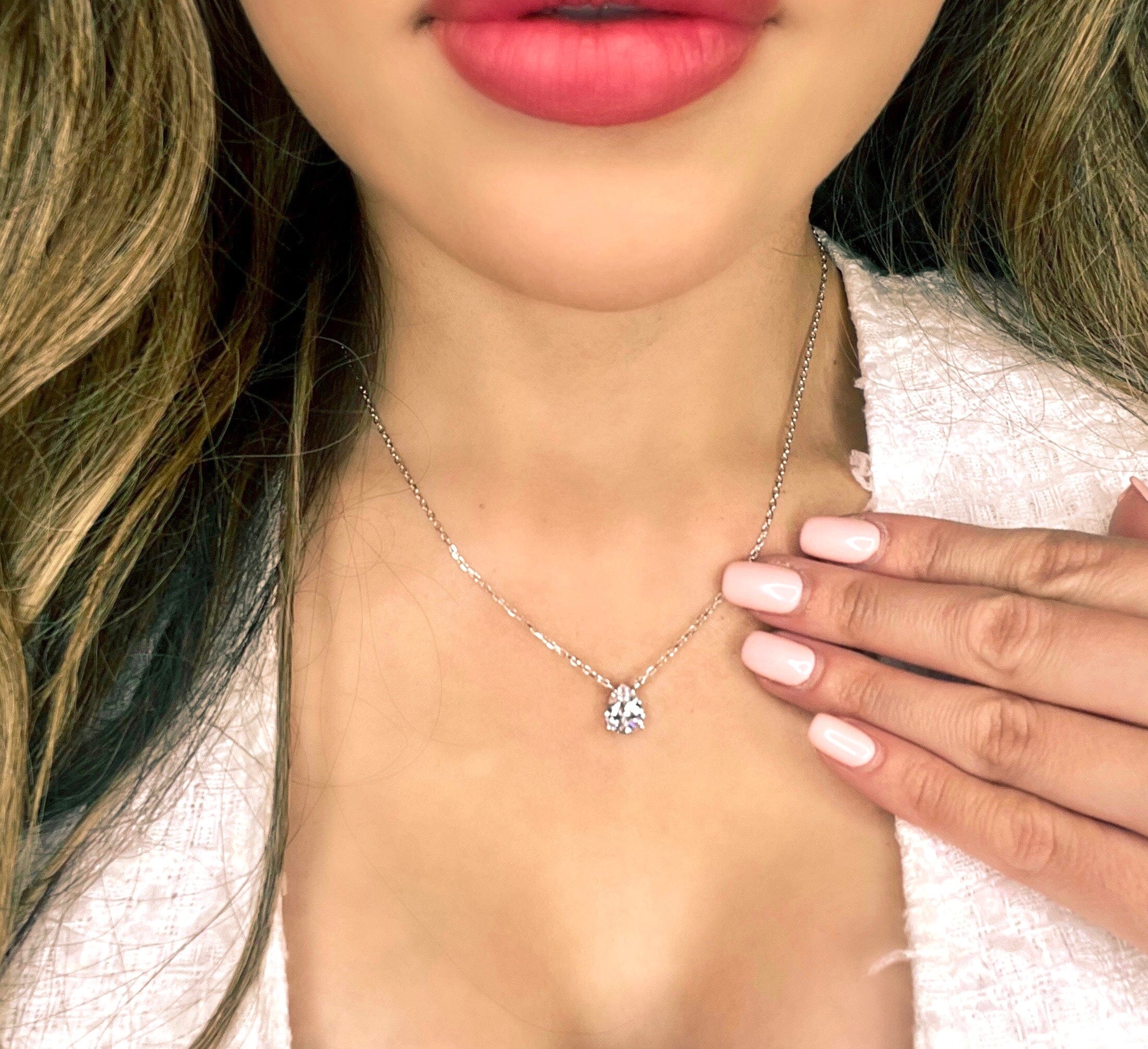 Model wearing the silver Leeloo teardrop necklace