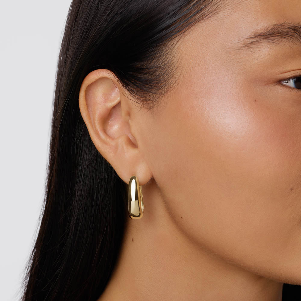 Sally Sterling Silver Gold Dome Chunky Hoops by Bloo & Ro feature a timeless sculptural design crafted from sterling silver with luxurious 18K gold plating. Lightweight, elegant, and perfect for everyday wear.