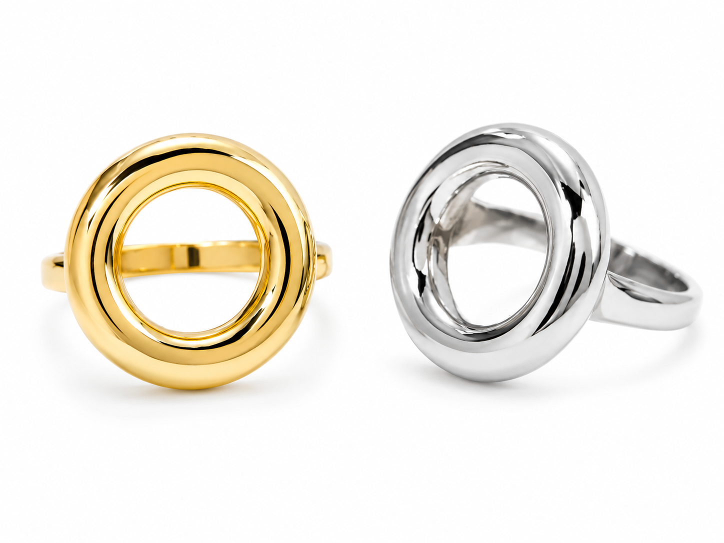 The Sofia Open Circle Ring shown in polished gold and silver finishes on a white backgroun