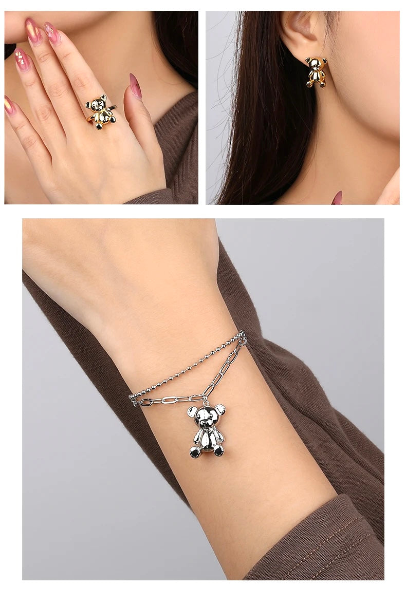 Model showcasing a teddy bear ring and coordinating bracelet