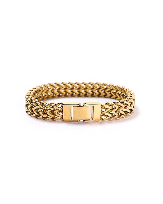 Cora bold gold Cuban chain bracelet displayed with its rectangular clasp facing forward on a white background