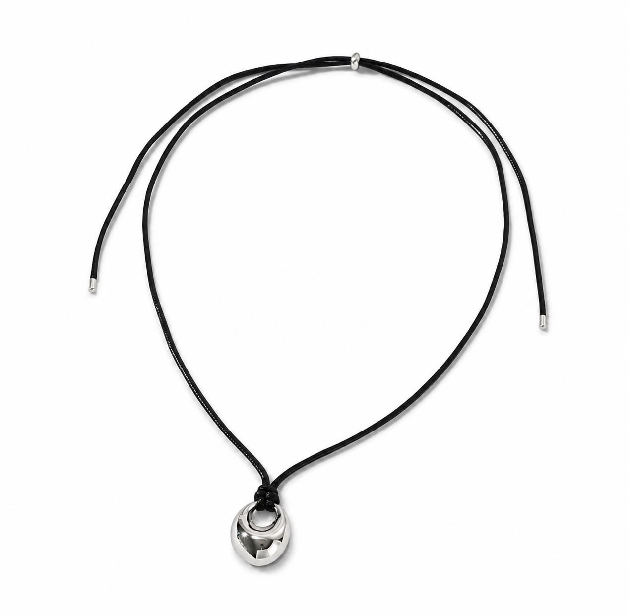The Elena adjustable black cord necklace with a polished silver-tone oval pendant on a white background.
