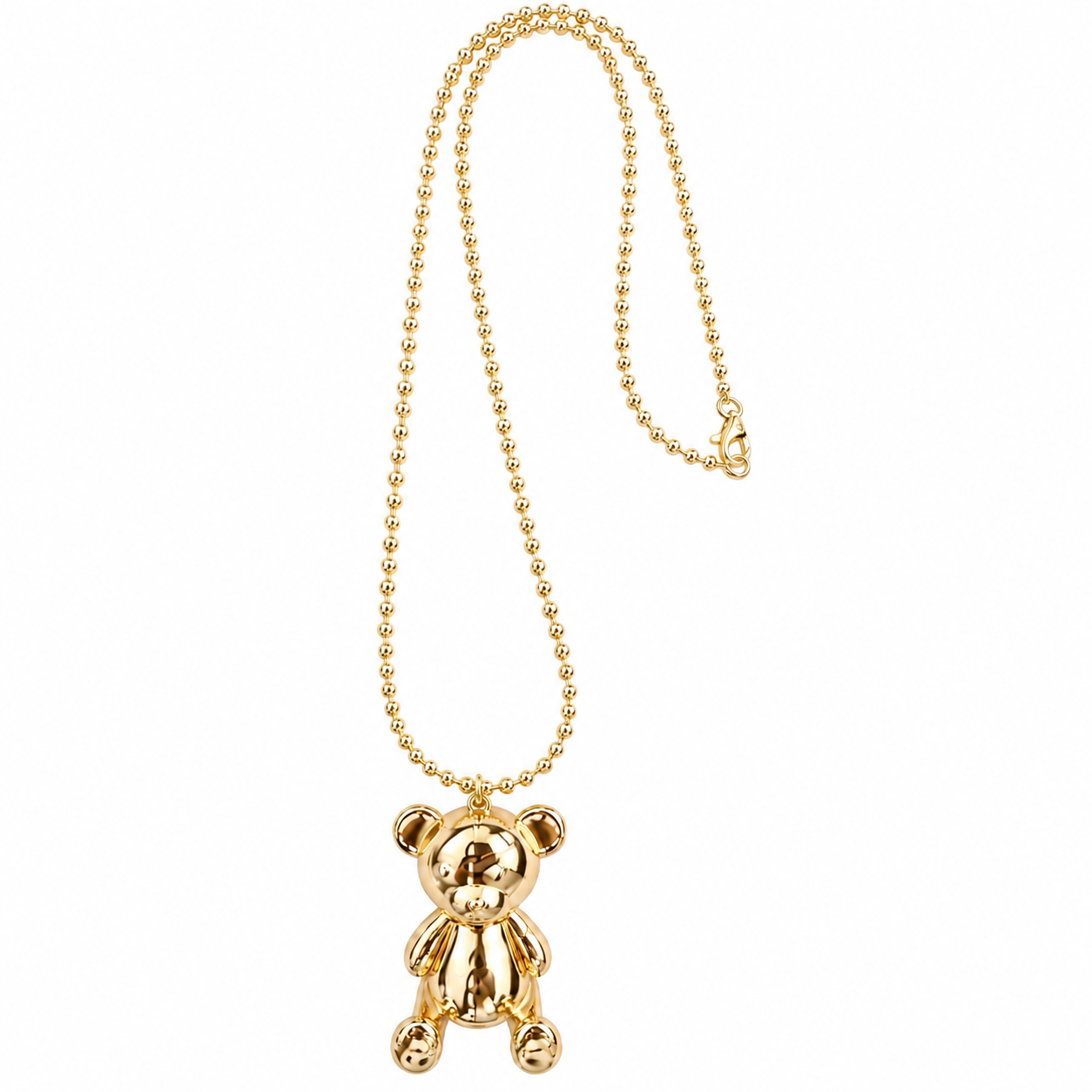 A gold ball chain necklace featuring a polished teddy bear pendant, shown against a plain white background.
