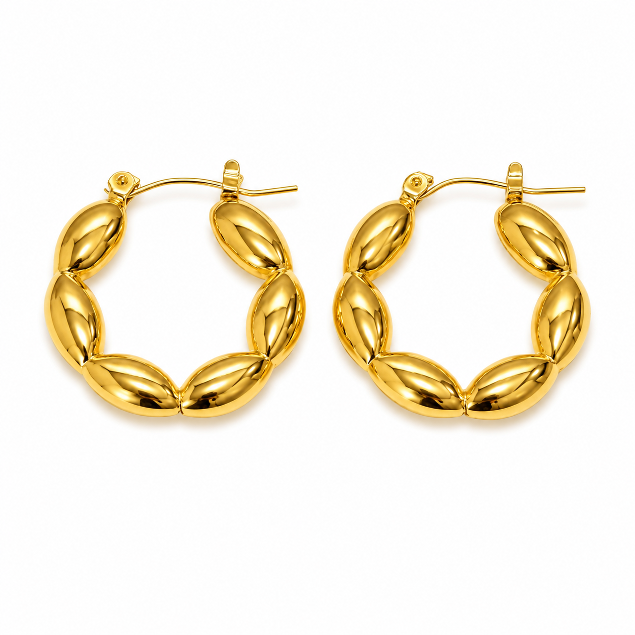 Veronica Hoops in 18K gold-plated stainless steel with a sculptural oval-link design on a white background